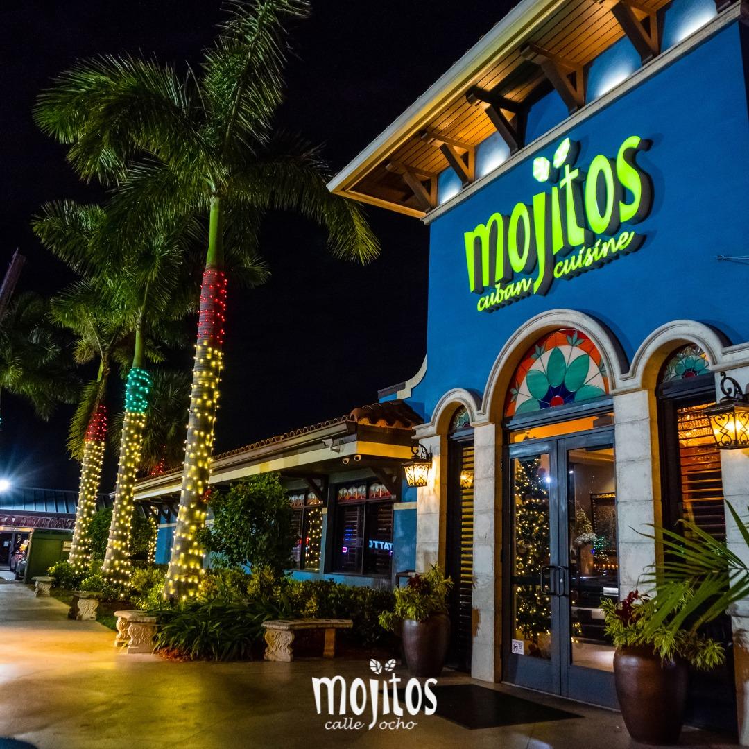 Mojitos Calle 8 — the iconic blue building on Calle Ocho at night
